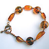 Amber fusion bracelet made with lentil lampworked beads and genuine baltic amber nuggets