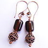 Earrings made with hand made recycled lampwork beads made from Black Dog beer bottles and copper beads