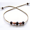 Handmade lampwork recycled glass beads on a simulated leather thong